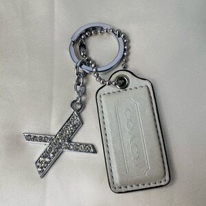 Coach hangtag with unbranded X keychain